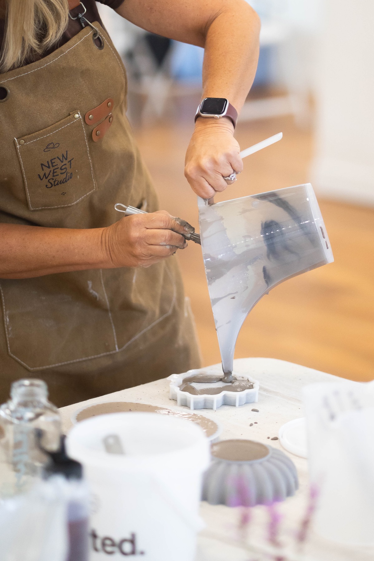 Prepared cement being poured into a mold