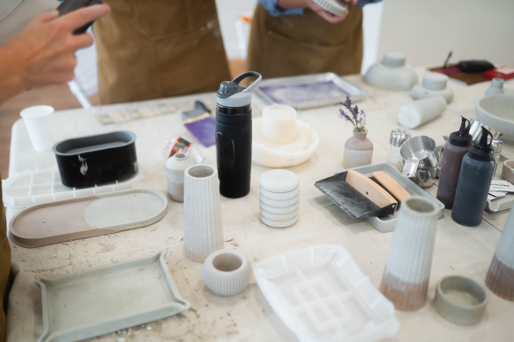 Handmade cement vases and trays from a Cemented workshop