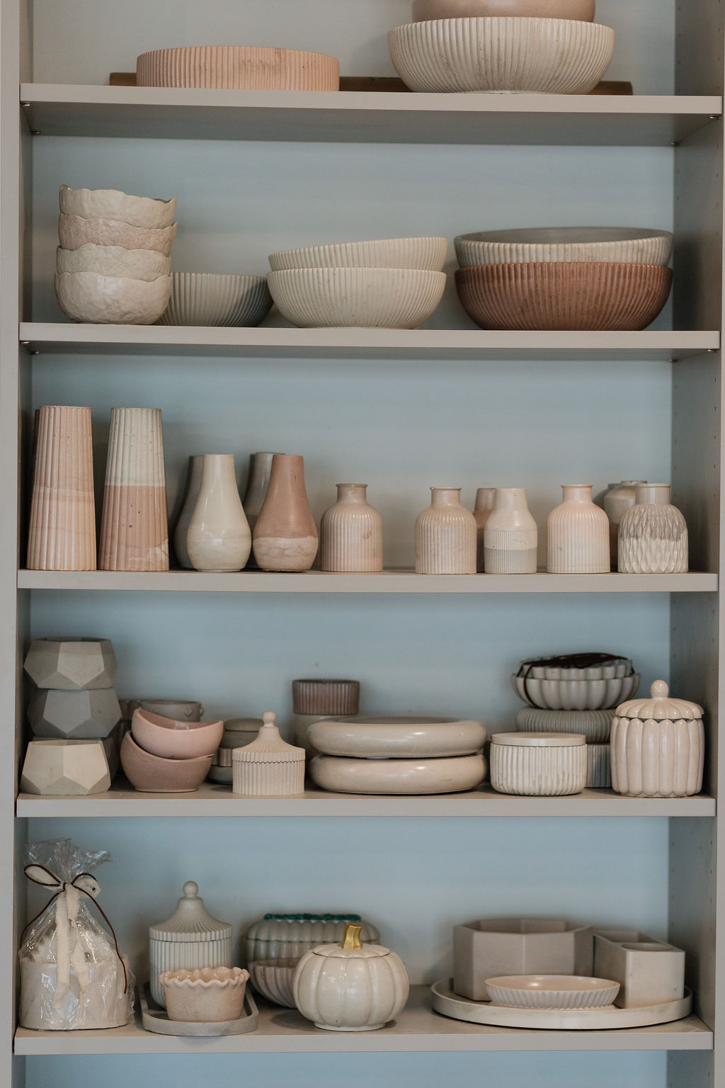 Cemented decor displayed on studio shelves